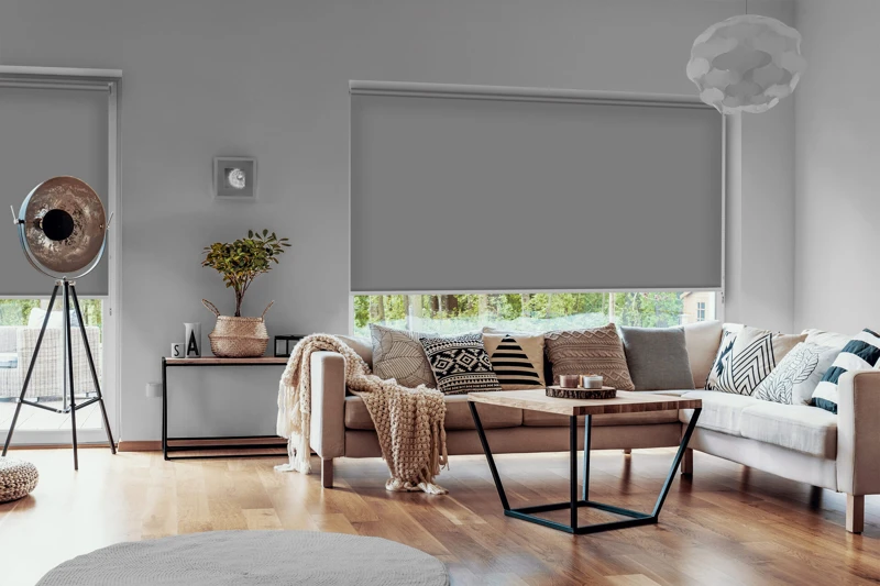 View outside to the green woods through large glass windows in a